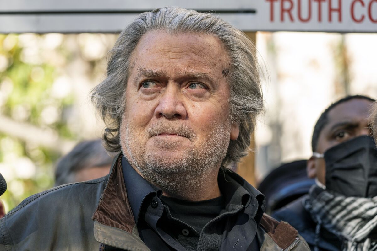 Former White House strategist Stephen K. Bannon speaks with reporters after departing federal court. 