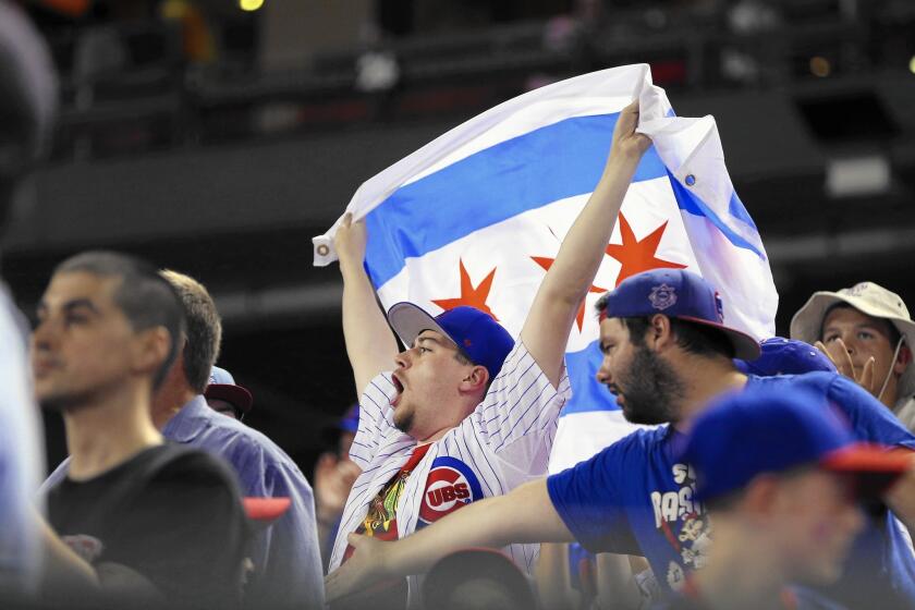 Chicago Cubs fans show their pride in St. Louis during an early-season game against the Cardinals.