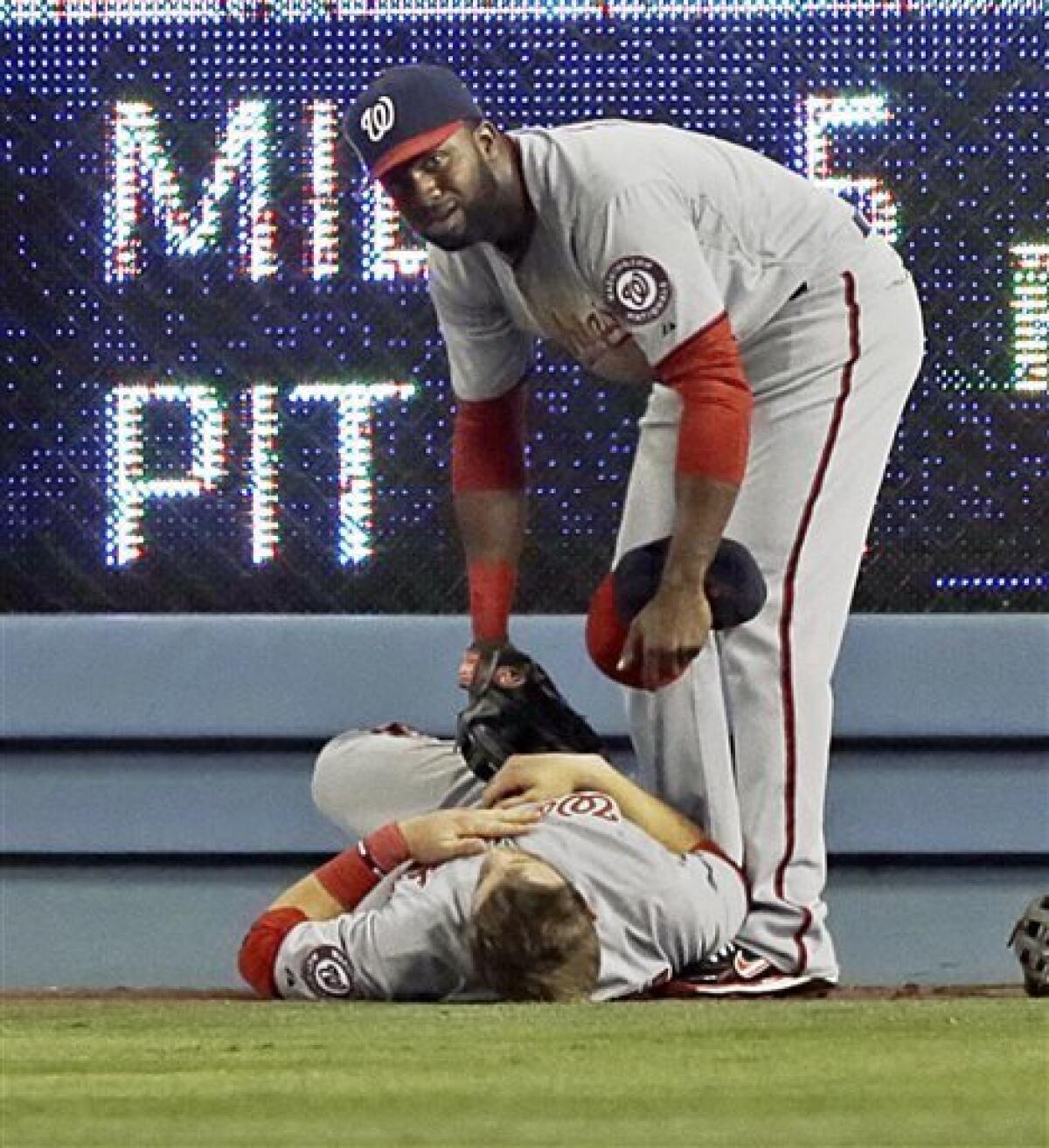 Bryce Harper leaves game with apparent left knee injury