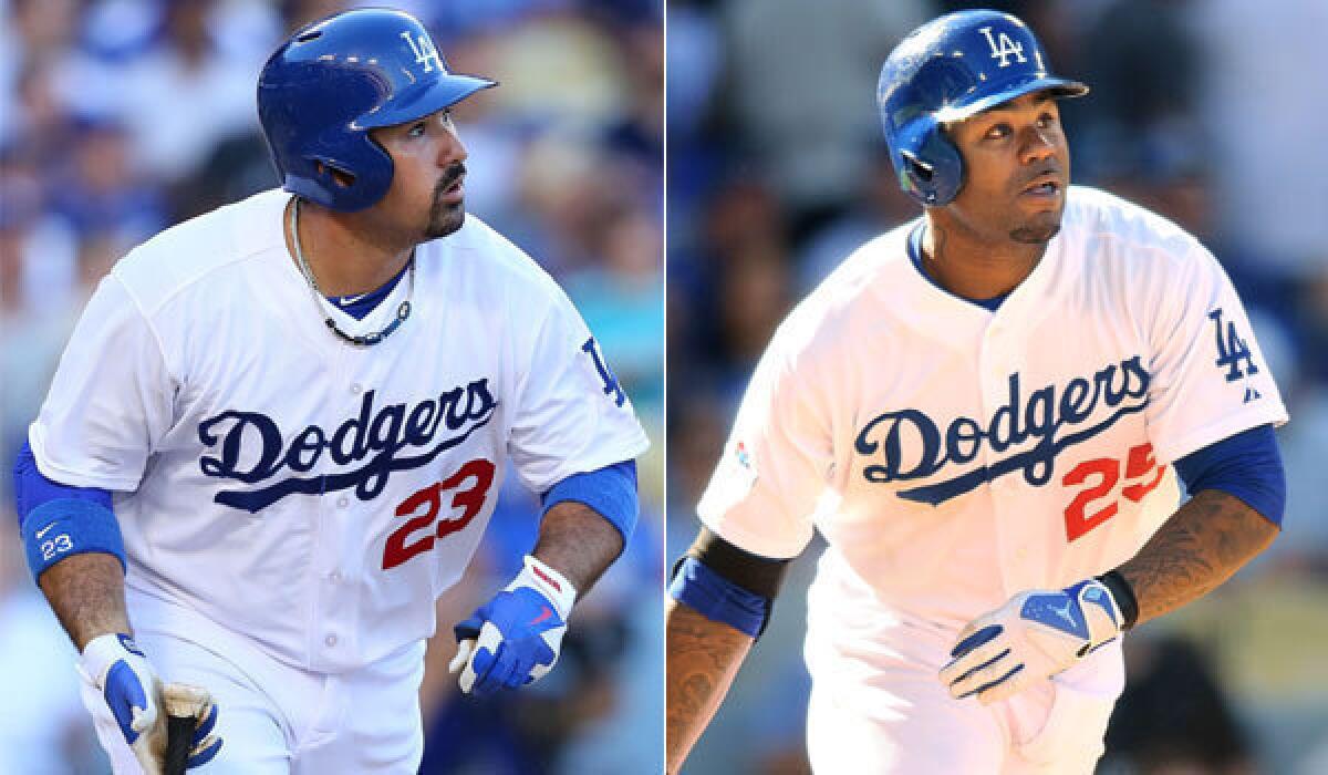 Dodgers first baseman Adrian Gonzalez hits a single to center to drive in Nick Punto and Matt Kemp in the first inning.