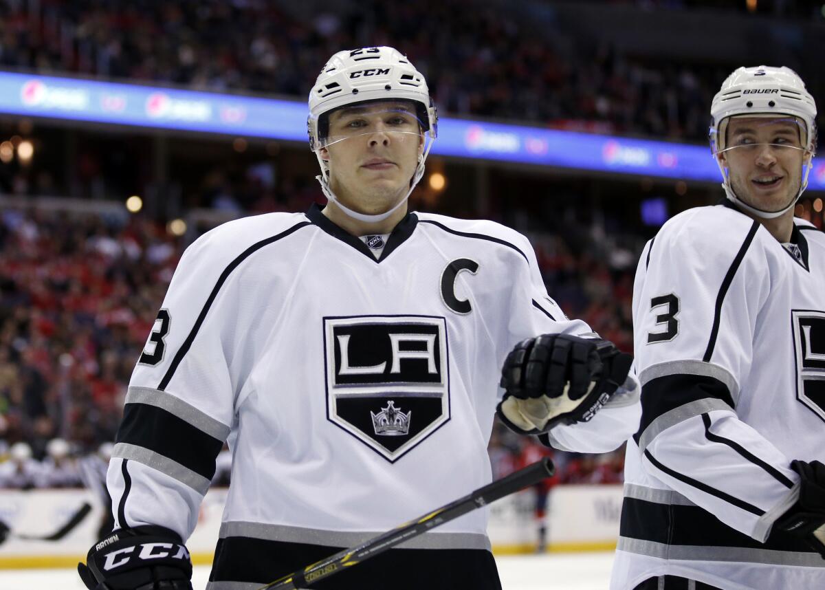 Kings captain Dustin Brown and defenseman Brayden McNabb skate during a break in the second period of L.A.'s 4-0 loss Tuesday to the Washington Capitals.