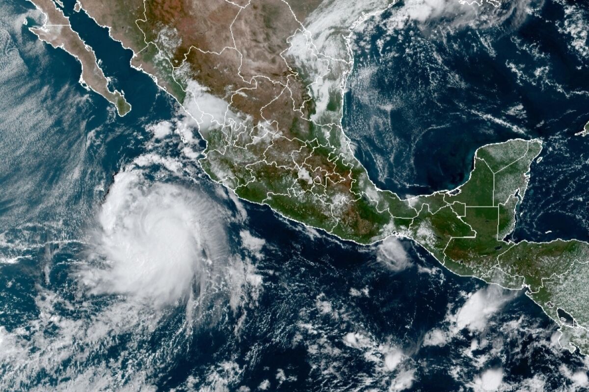 This satellite image provided by the National Oceanic and Atmospheric Administration (NOAA) shows a Tropical Storm Pamela in the Pacific as it approaches Mexico at 15:30Oz, or 11:30 am EST, Monday, Oct. 11, 2021. Pamela was forecast to take a turn toward the north and northeast, passing close to the southern tip of the Baja California peninsula late Tuesday or early Wednesday at hurricane strength, and forecast to make landfall Wednesday near Mazatlan, potentially as a Category 3 hurricane. (NOAA/NESDIS/STAR GOES via AP)