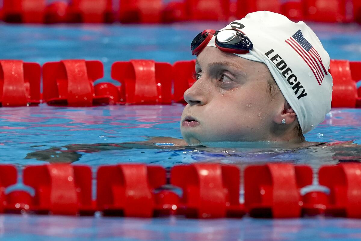Katie Ledecky reacts after her women's 1,500-meter freestyle qualifying heat at the Tokyo Olympics.