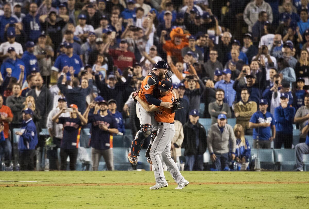 The Houston Astros celebrate after beating the Dodgers to win the World Series at Dodger Stadium in 2017.