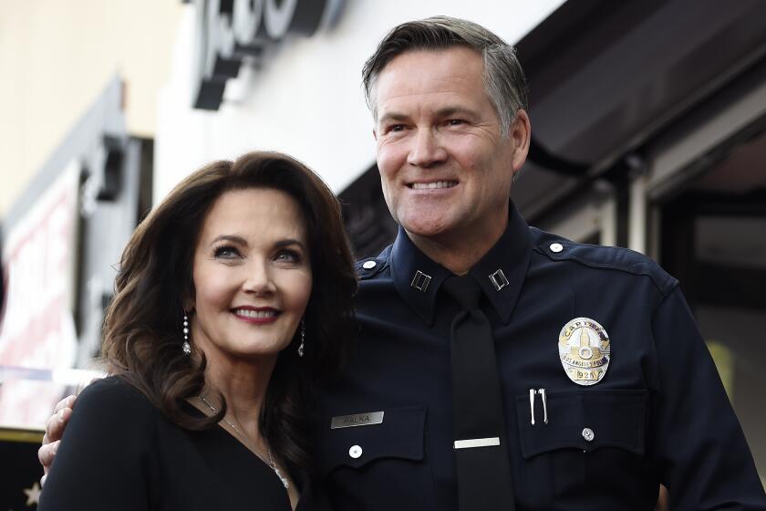 Lynda Carter, left, poses with former Los Angeles Police Department Captain Cory Palka