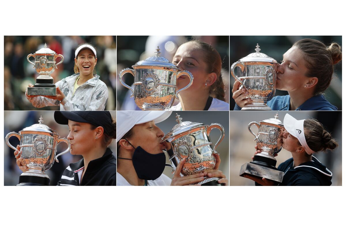 FILE - From the French Open tennis tournament in Paris, top from left; Garbine Muguruza holds the trophy after defeating Serena Williams, Saturday, June 4, 2016; Latvia's Jelena Ostapenko kisses the cup after defeating Romania's Simona Halep, Saturday, June 10, 2017; Romania's Simona Halep kisses the trophy after defeating Sloane Stephens, Saturday, June 9, 2018. Bottom from left: Australia's Ashleigh Barty kisses the trophy after defeating Marketa Vondrousova of the Czech Republic, Saturday, June 8, 2019; Poland's Iga Swiatek kisses the trophy after defeating Sofia Kenin, Saturday, Oct. 10, 2020; Barbora Krejcikova kisses the trophy after defeating Russia's Anastasia Pavlyuchenkova, Saturday, June 12, 2021. Each of the past six women to win the trophy at Roland Garros had never won a Slam title – some had never won a title anywhere. (AP Photo/File)