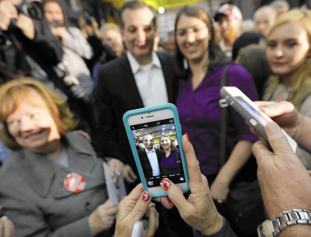 Republican presidential candidate, Sen. Ted Cruz, R-Texas, center, left, poses for a photograph with supporters during a rally, Wednesday, Feb. 24, 2016, in Houston.