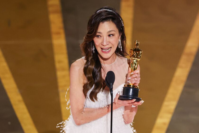 HOLLYWOOD, CA - MARCH 12: Michelle Yeoh accepts the award for Actress in a Leading Role at the 95th Academy Awards in the Dolby Theatre on March 12, 2023 in Hollywood, California. (Myung J. Chun / Los Angeles Times)