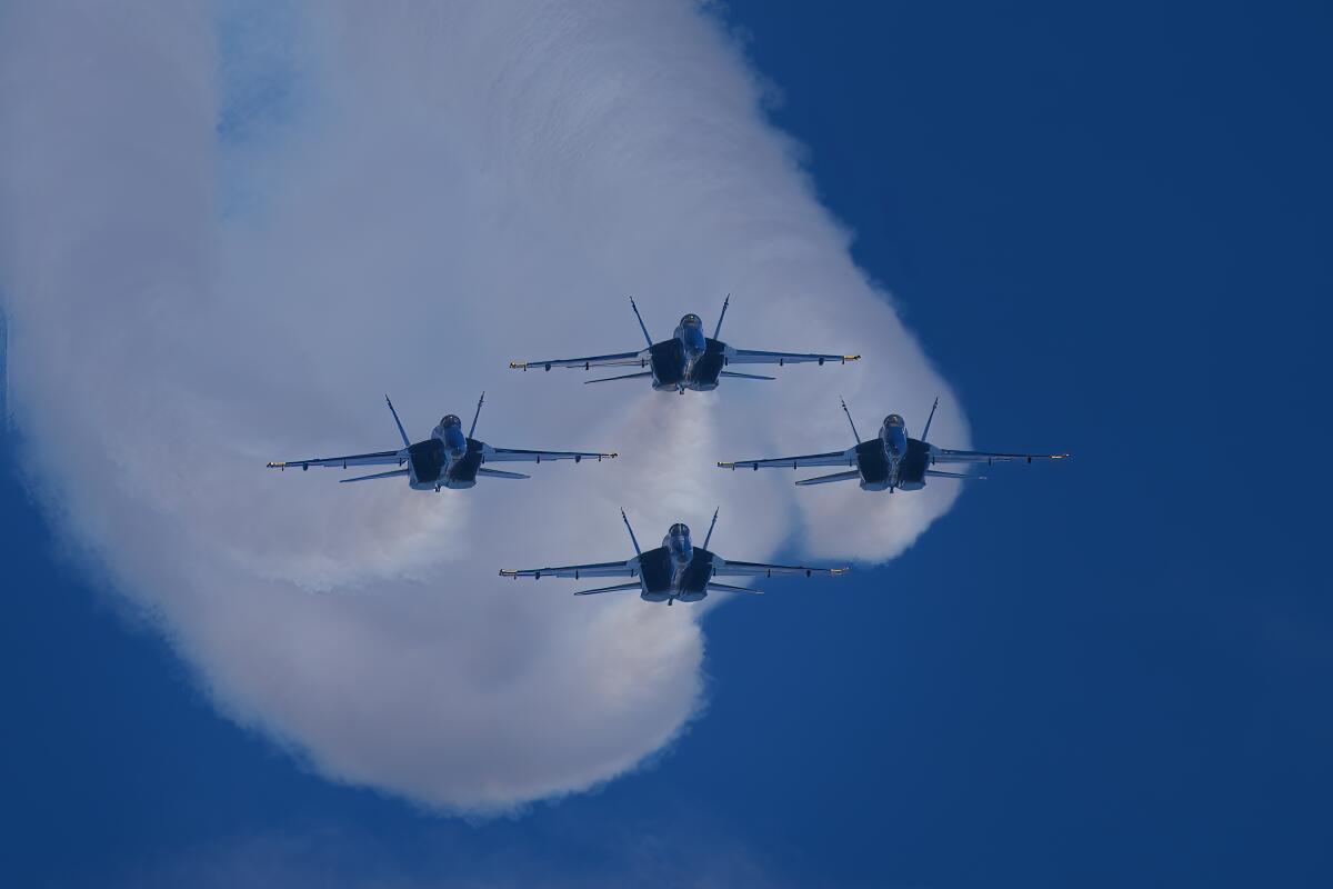 The Navy’s precision Blue Angles flight team fly above the crowd at the MCAS Miramar Air Show
