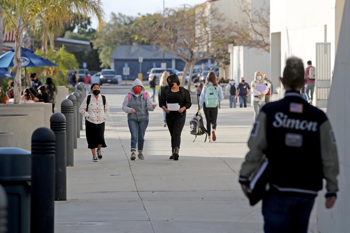 Students return to campus for full-day learning at Newport Harbor High School in Newport Beach on Tuesday, April 27, 2021. 