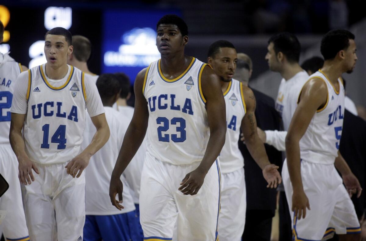 Zach LaVine, left, and Tony Parker, right, get ready before UCLA's victory over Colorado, 92-74, on Thursday at Pauley Pavilion.