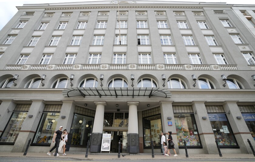 The modernist 1914 six-story building of the Jablkowski Brothers Department Store that survived World War II bombings by Nazi Germany is a historic landmark, in Warsaw, Poland, Saturday, July 10, 2021. After World War II the business was forced into bankruptcy and seized by the communist regime. The Jablkowski family regained the historic building in a long battle after communism fell, and were preparing to relaunch business when the pandemic hit and forced some changes to their plans, but did not undermine them. (AP Photo/Czarek Sokolowski)