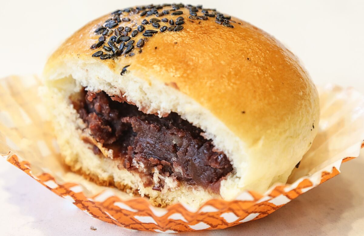 The Red Bean Bread at 85°C Bakery Cafe  is one of the few items with a name that implies it's filled. The light, fluffy brioche-style bun is topped with crispy black sesame seeds.