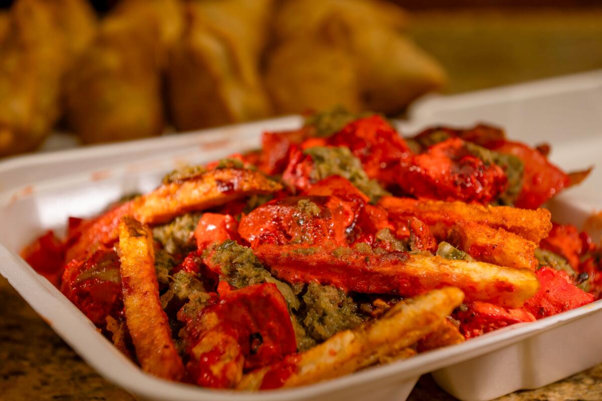 Chicken tikka masala fries in a container