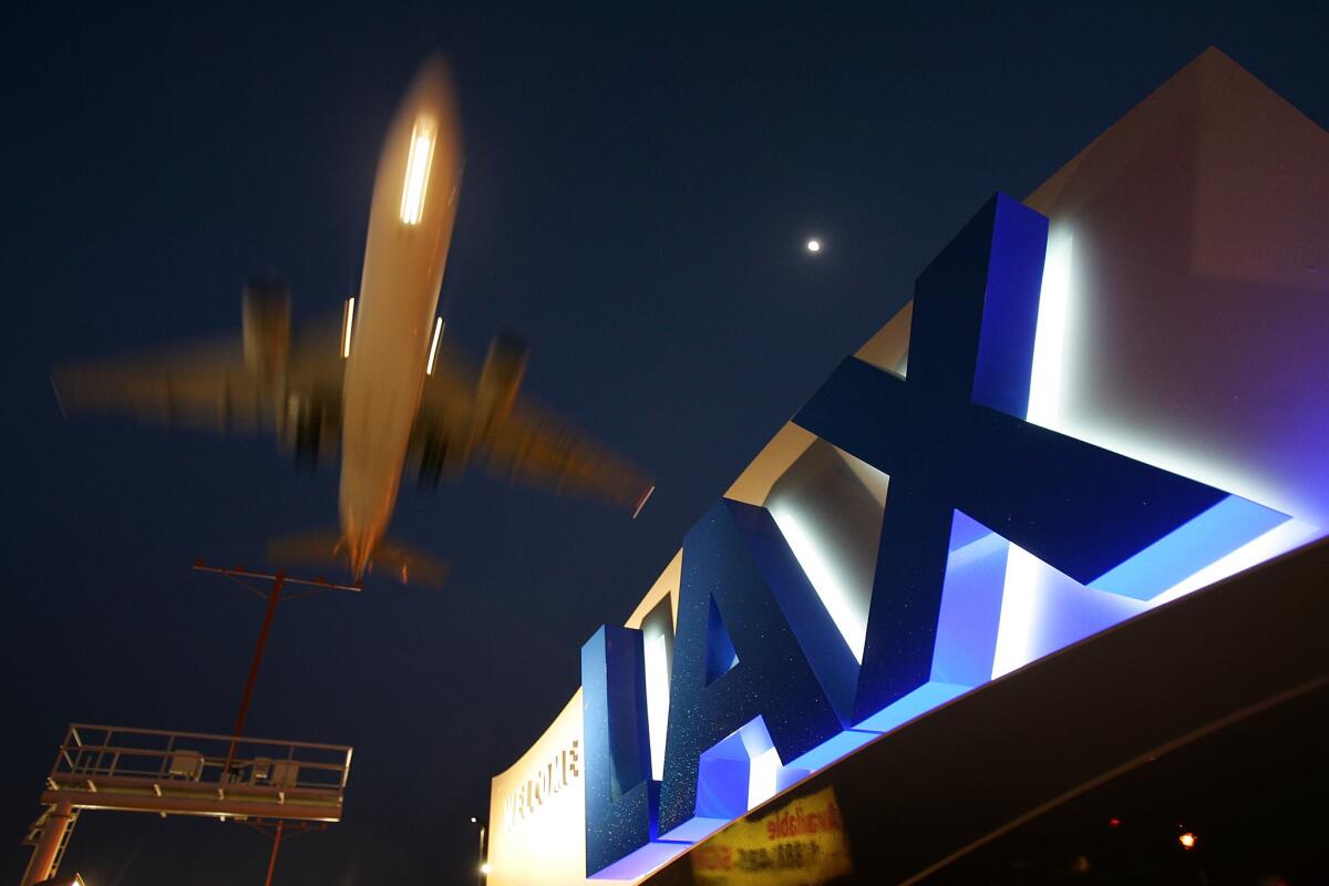 A jet comes in for a landing at Los Angeles International Airport.