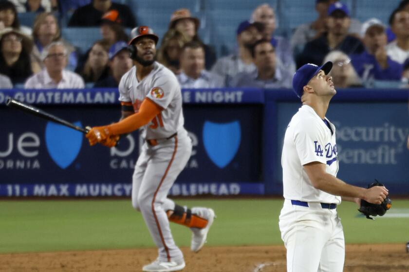 Los Angeles, CA - August 27: Dodgers starting pitcher Jack Flaherty #0, watches the final out of the sixth inning as Orioles center fielder Cedric Mullins #31, left watches his ball fly out at Dodger Stadium in Los Angeles Tuesday, Aug. 27, 2024. (Allen J. Schaben / Los Angeles Times)