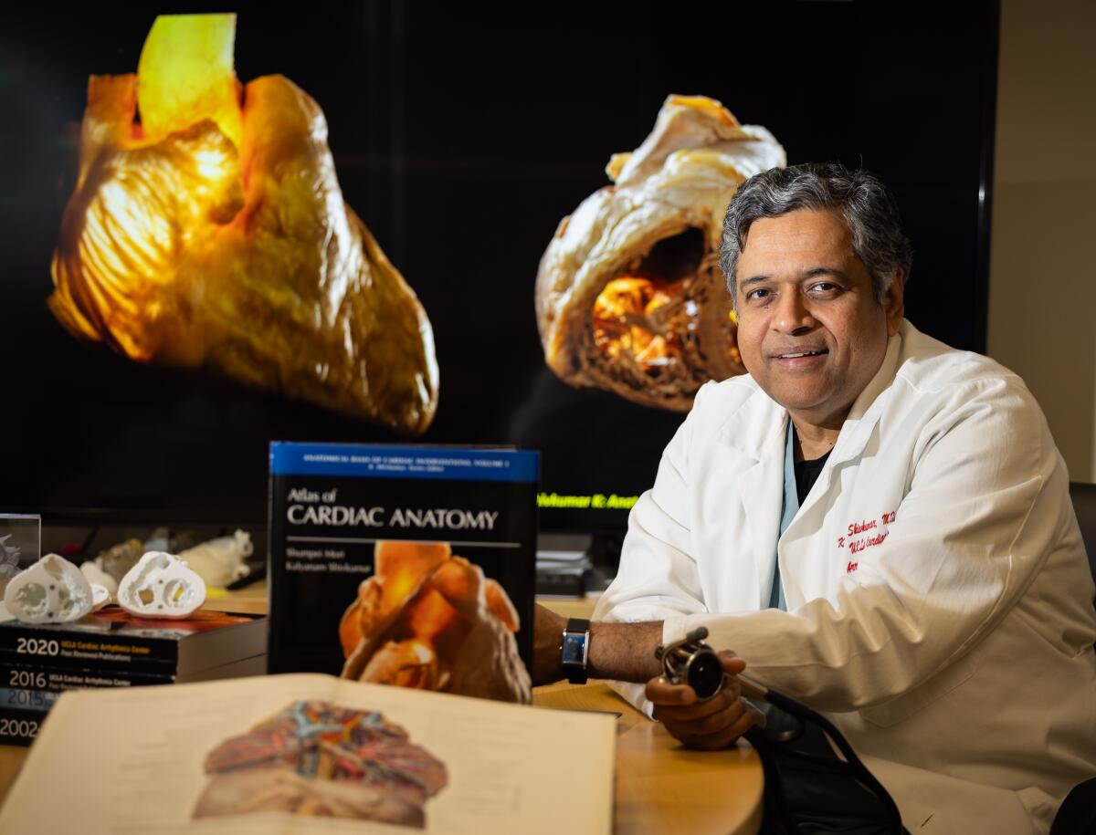 UCLA medical professor Dr. Kalyanam Shivkumar with his book, "Atlas of Cardiac Anatomy," on May 9.