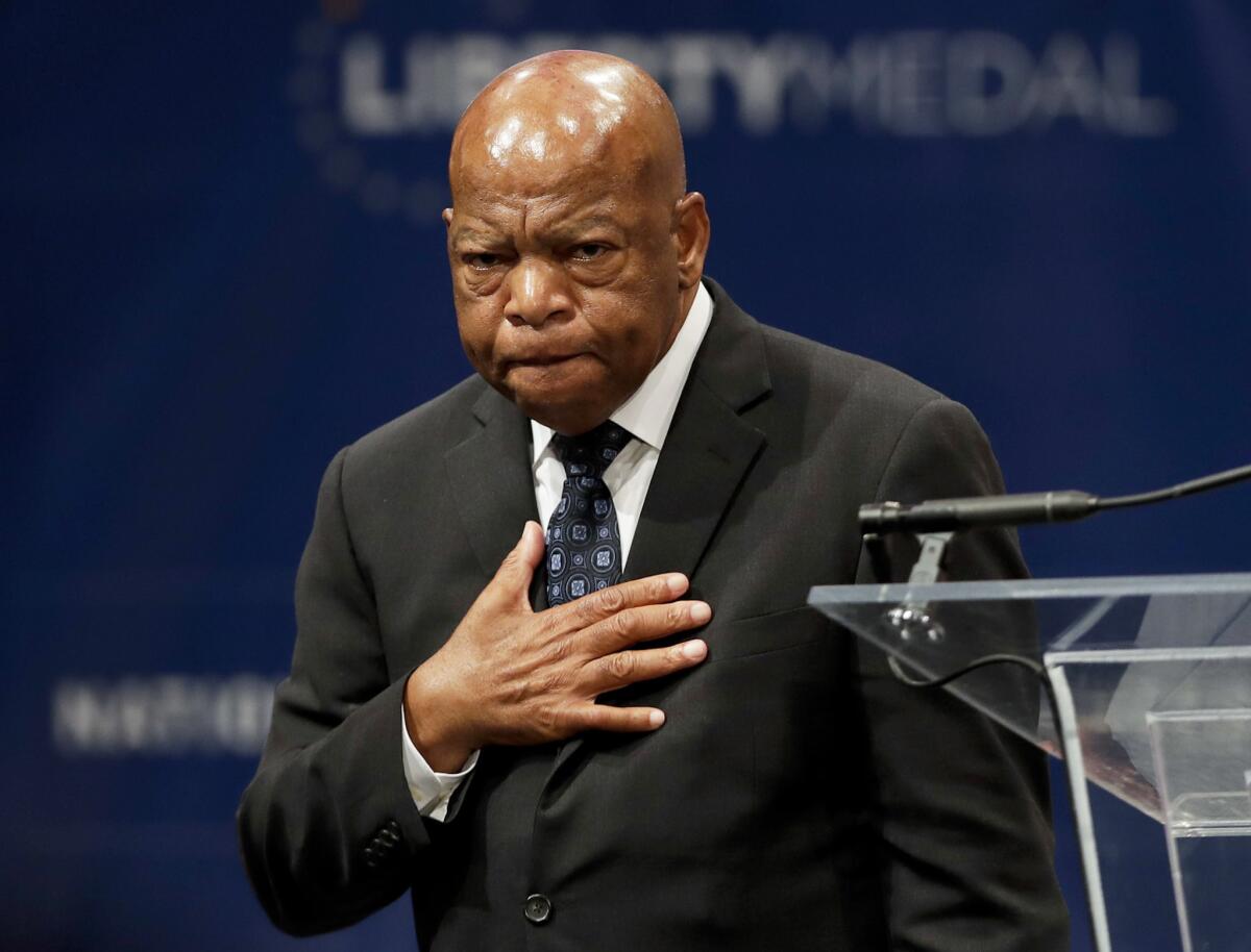 U.S. Rep. John Lewis being presented with the Liberty Medal in September for his dedication to civil rights. At Wednesday's National Book Awards, Lewis was a winner of the young people's literature prize for his collaboration on the graphic novel "March: Book Three."