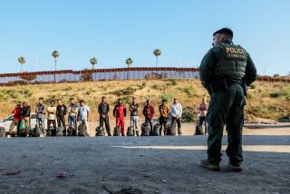 San Diego, CA, Wednesday, June 5, 2024 - Dozens of people seeking asylum are detained by border patrol after crossing the US/Mexico border. (Robert Gauthier/Los Angeles Times)