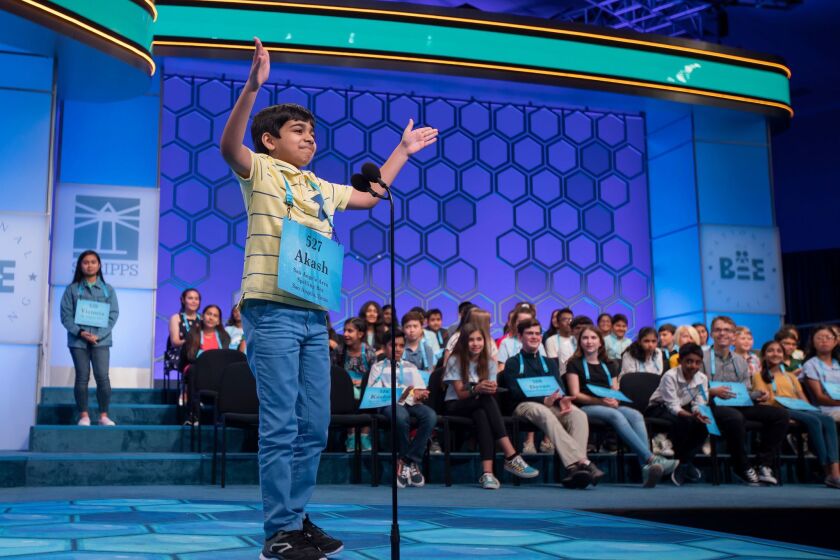 Mandatory Credit: Photo by ERIK S LESSER/EPA-EFE/REX (10255857af) Akash Vukoti of San Angelo, Texas, reacts after correctly spelling 'quota' during the third round of the 2019 Scripps National Spelling Bee at National Harbor in Oxon Hill, Maryland, USA, 29 May 2019. The 92nd year of the Scripps National Spelling Bee features 562 competitors and continues through 30 May 2019. 2019 Scripps National Spelling Bee at National Harbor on Oxon Hill, Maryland, USA - 29 May 2019 ** Usable by LA, CT and MoD ONLY **