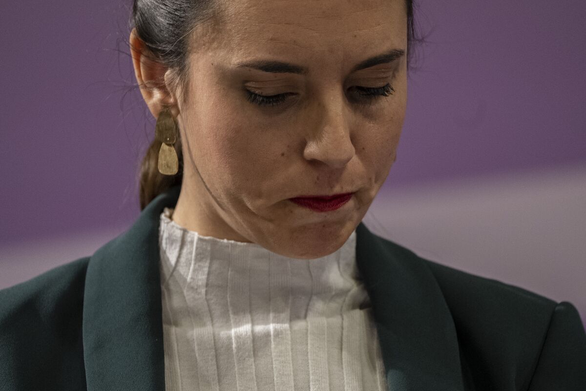 Spain's Equality Minister Irene Montero looks down during a press conference after an emergency meeting for a worrying surge of gender violence in Madrid, Spain, Friday, Jan. 27, 2023. A spate of gender-based violence, coupled with the early release of sex offenders, has increased pressure on Spain's left-wing government, which strongly plays up its feminist credentials, to do more to protect women from abuse. (AP Photo/Manu Fernandez)