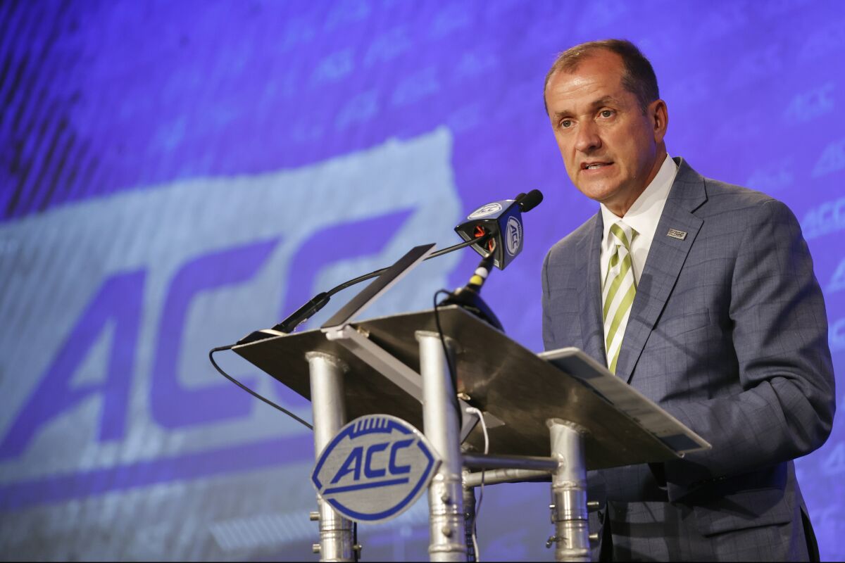 Atlantic Coast Conference commissioner Jim Phillips speaks during an NCAA college football news conference at the ACC media days in Charlotte, N.C., Wednesday, July 20, 2022. (AP Photo/Nell Redmond)