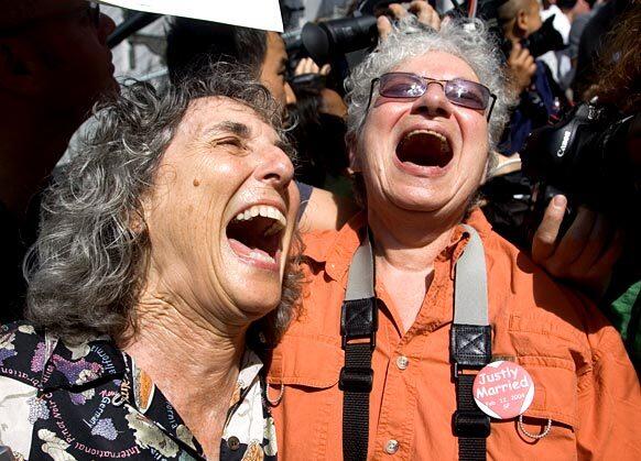 Ellen Pontac, left, and Shelly Bailes, of Davis, Calif., celebrate on the steps of the state Supreme Court after the court's decision legalizing marriage between same-sex couples in San Francisco. They have been together 34 years and were married in San Francisco before it was ruled illegal.