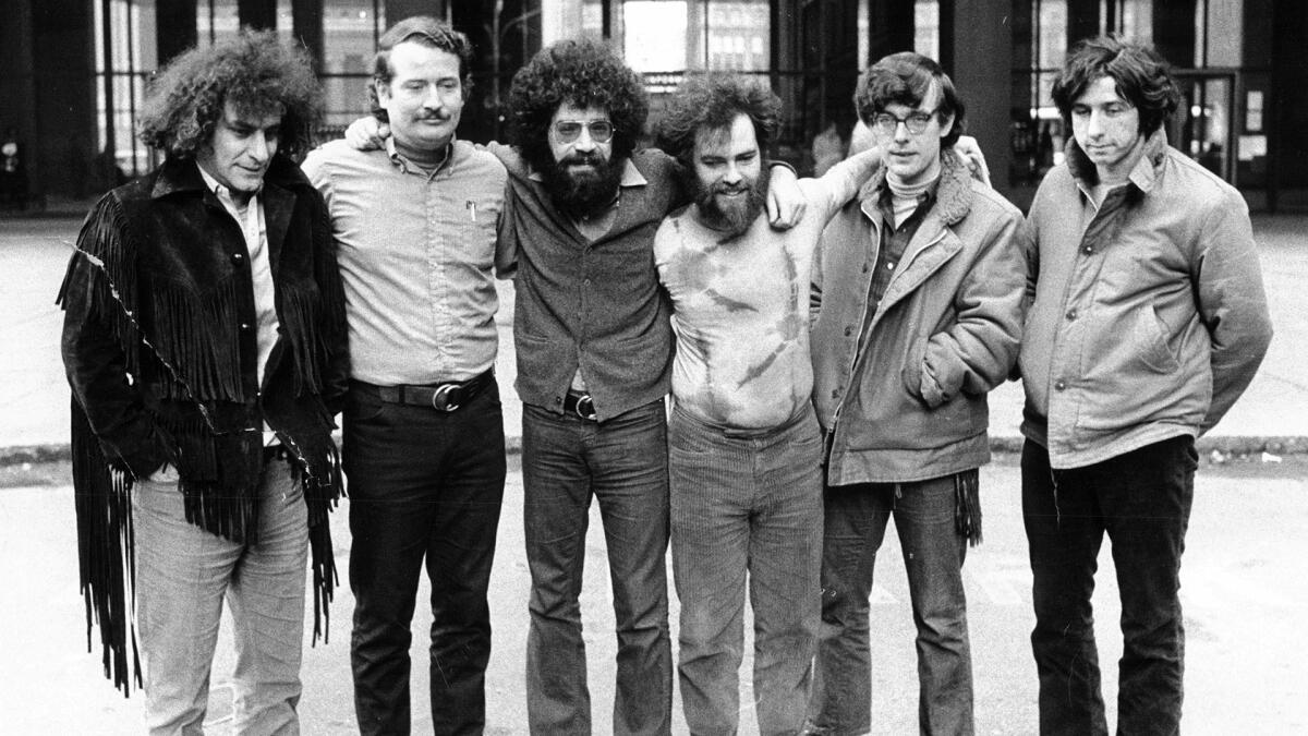 Six of the Chicago Seven defendants pose outside of the Federal Building in Chicago during their conspiracy trial on Feb. 11, 1970. From left are: Abbie Hoffman, John Froines, Lee Weiner, Jerry Rubin, Rennie Davis, and Tom Hayden.