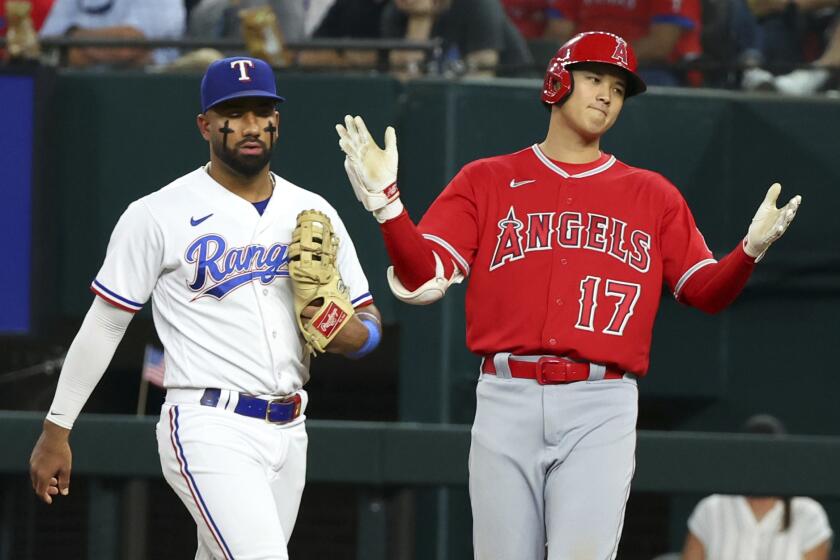 Los Angeles Angels' Shohei Ohtani (17) gestures after reaching first on a single during the fourth inning against the Texas Rangers in a baseball game, Wednesday, June 14, 2023, in Arlington, Texas. (AP Photo/Richard W. Rodriguez)