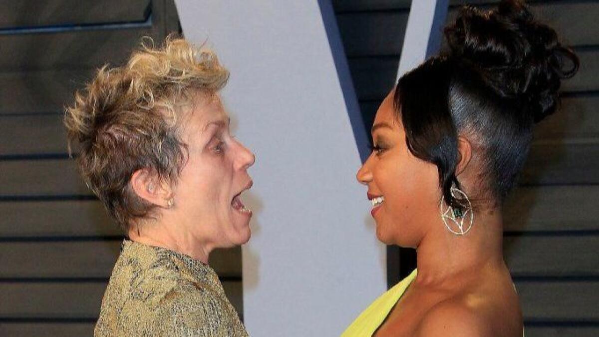 Frances McDormand, left, and Tiffany Haddish chat at the 2018 Vanity Fair Oscar party after the 90th Academy Awards ceremony in Beverly Hills.