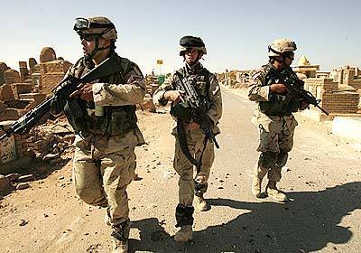 Soldiers make their way into the Najaf cemetery where they encountered insurgents.