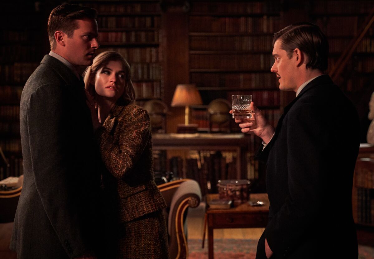 Armie Hammer, Lily James and Sam Riley in the movie "Rebecca."