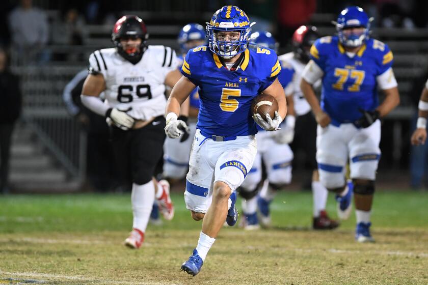 La Puenta, California November 4, 2022-Bishop Amat running back Aiden Ramos picks up yards against the Murrieta Valley defense in the third quarter in La Puenta Friday.(Wally Skalij/Los Angeles Times)