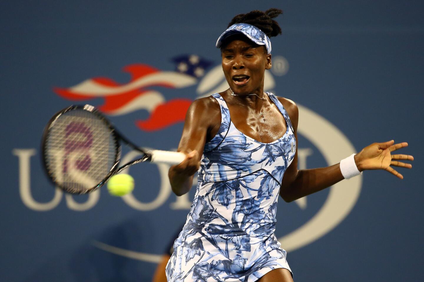 Venus Williams returns a shot against Timea Bacsinszky during a second-round match.