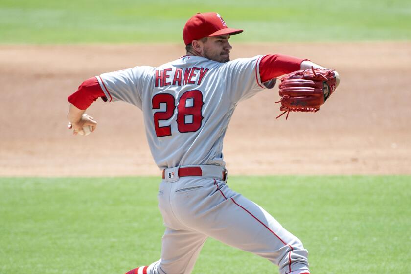 Los Angeles Angels starting pitcher Andrew Heaney (28) works against the Texas Rangers during the first inning of the first baseball game of a doubleheader Tuesday, Aug. 20, 2019, in Arlington, Texas. (AP Photo/Jeffrey McWhorter)