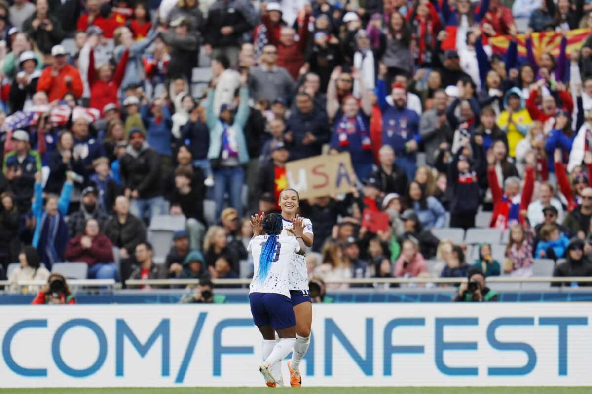 Sophia Smith, right, celebrates with Crystal Dunn after scoring a second goal for the U.S.
