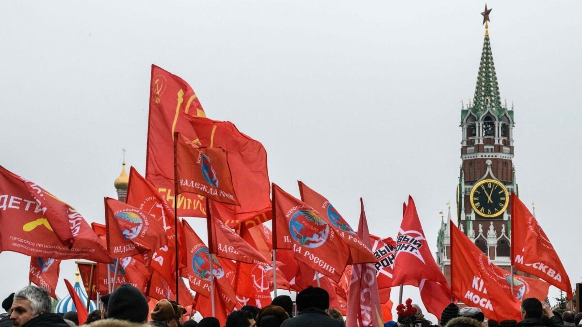 Russians gather at the grave of Josef Stalin outside the Kremlin in Moscow on March 5, the anniversary of the dictator's death.