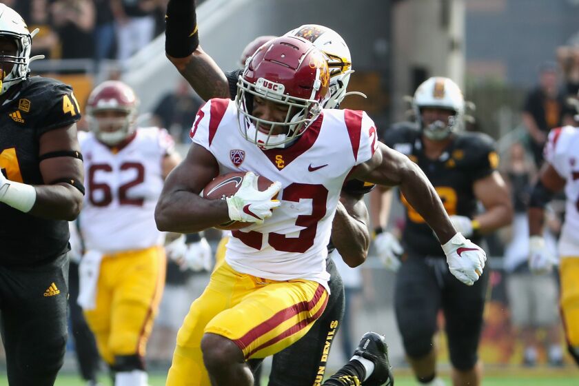 TEMPE, ARIZONA - NOVEMBER 09: Running back Kenan Christon #23 of the USC Trojans runs with the football en route to scoring on a 58 yard touchdown reception ahead of defensive lineman Tyler Johnson #41 of the Arizona State Sun Devils during the first half of the NCAAF game at Sun Devil Stadium on November 09, 2019 in Tempe, Arizona. (Photo by Christian Petersen/Getty Images)