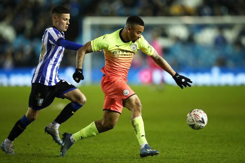 SHEFFIELD, ENGLAND - MARCH 04: Gabriel Jesus of Manchester City battles for possession with Alex Hunt of Sheffield Wednesday during the FA Cup Fifth Round match between Sheffield Wednesday and Manchester City at Hillsborough on March 04, 2020 in Sheffield, England. (Photo by Clive Brunskill/Getty Images)