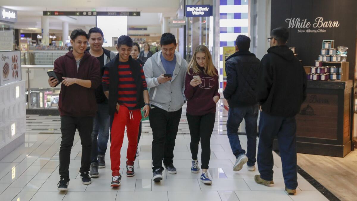 Seniors at Chatsworth Charter High School hang out inside the Northridge Fashion Center instead of being in class as a result of the teachers' strike.