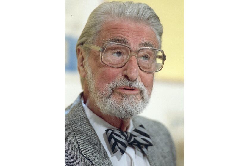 FILE - American author, artist and publisher Theodor Seuss Geisel, known as Dr. Seuss, appears at an event in Dallas on April 3, 1987. More than 1.2 million copies of stories by the children’s author sold in the first week of March 2021, following the news that his estate was pulling six books because of racial and ethnic stereotyping. For days virtually every book in the top 20 on Amazon’s bestseller list was by Dr. Seuss. According to NPD BookScan, which tracks around 85 percent of retail sales, the top sellers weren’t even the books being withdrawn. “The Cat in the Hat” sold more than 100,000 copies. (AP Photo/File)