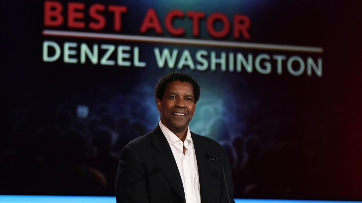 Denzel Washington accepts the award for best actor at AARP's 16th annual Movies for Grownups Awards.