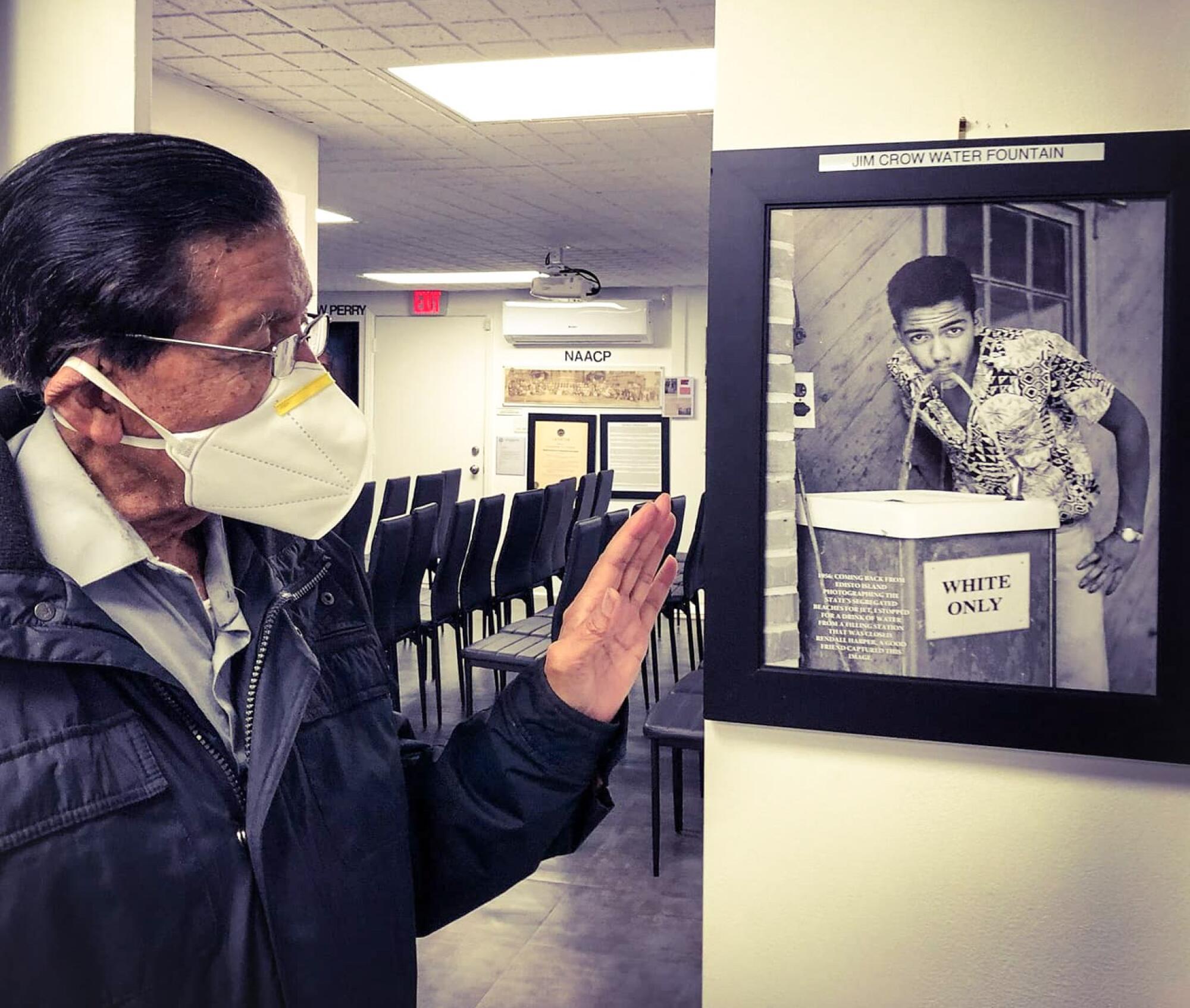 Cecil Williams with a photo he took of himself.