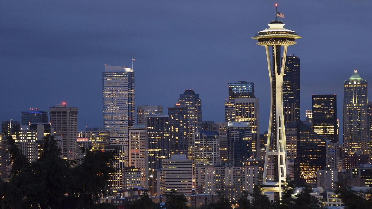 Seattle's Space Needle, which opened in 1962, helped give the city its current identify.