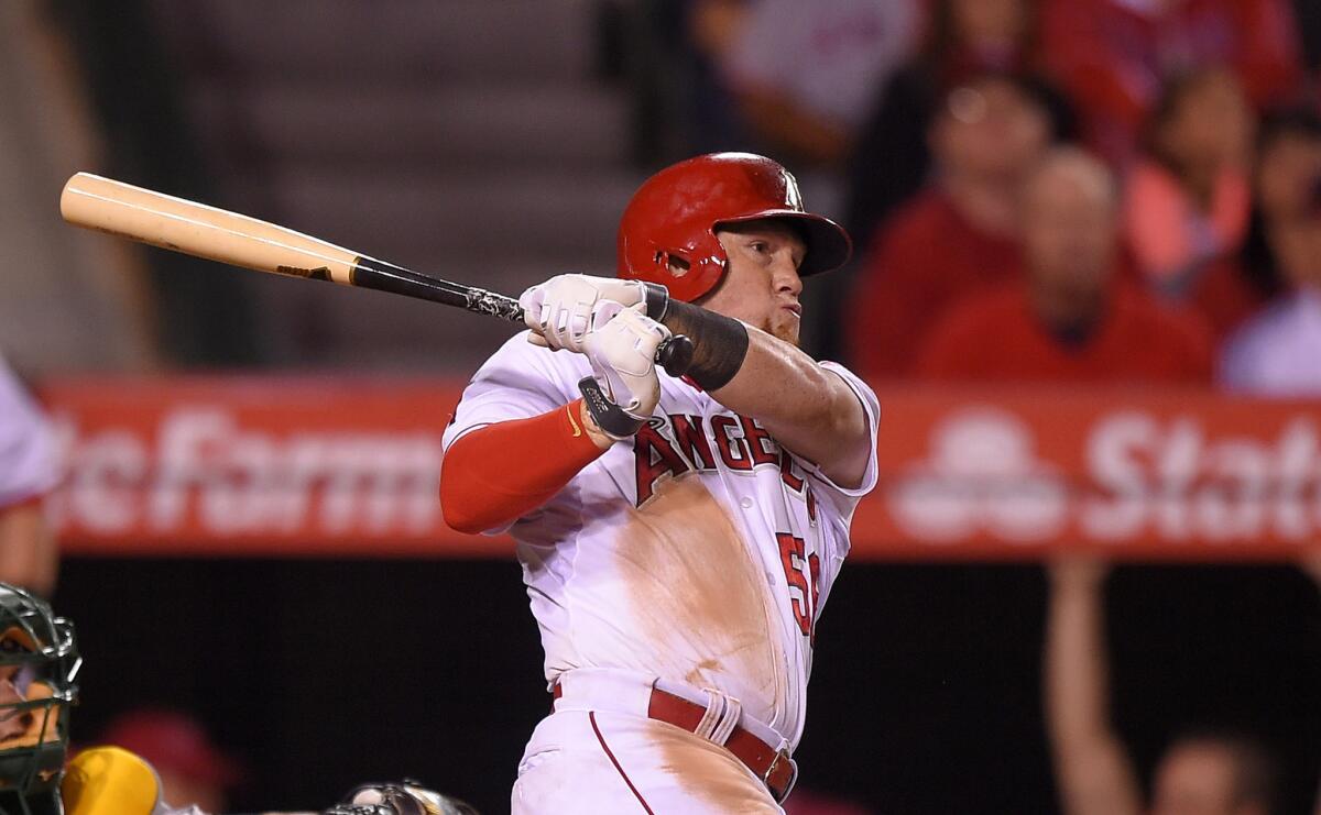 Kole Calhoun hits a solo home run in the eighth inning against the Athletics on Friday to give the Angels a 5-4 win at Angel Stadium.