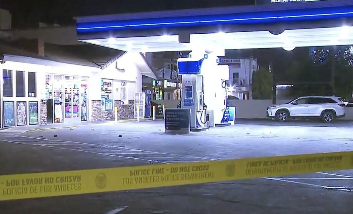 Crime scene tape at a gas station