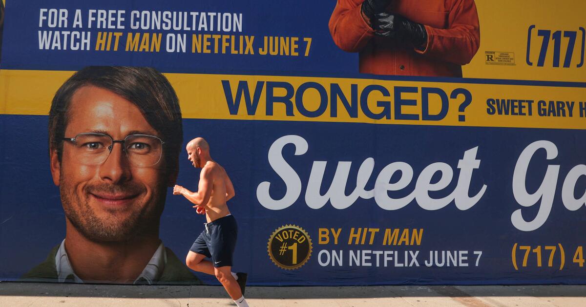 Require a ‘Hit Man’? Netflix spoofs L.A.’s renowned law firm billboards to industry new movie