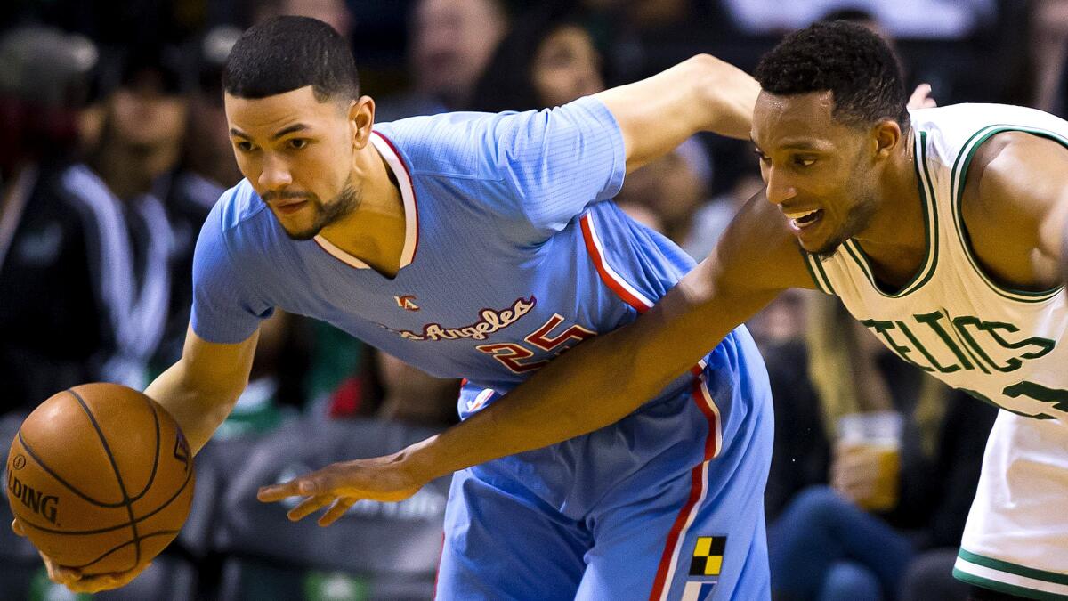 Clippers guard Austin Rivers steals the ball from Celtics forward Evan Turner during a game last season.
