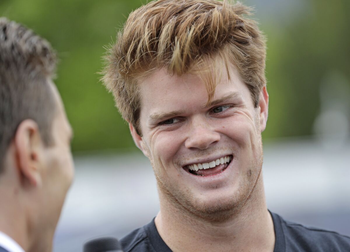 Former USC quarterback Sam Darnold talks with members of the media after a football clinic Wednesday in Arlington, Texas.