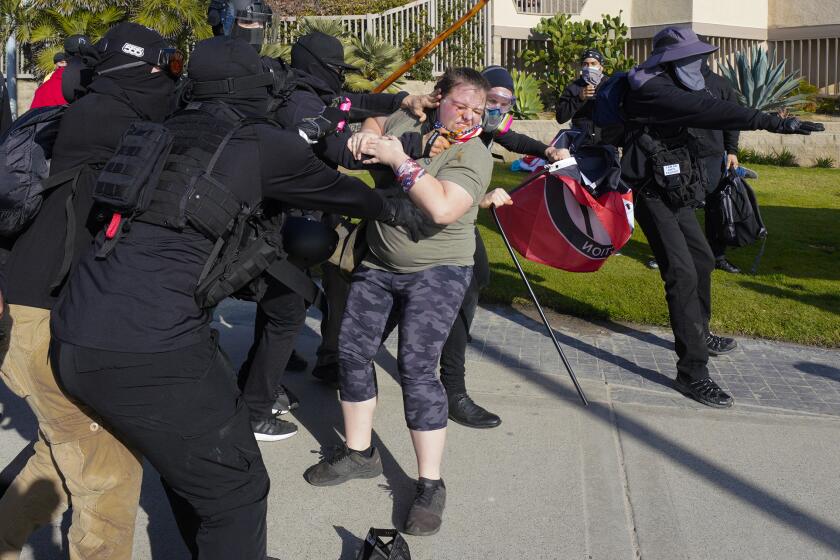 SAN DIEGO, CA - JANUARY 07: On Thursday, Jan. 9, 2021 in San Diego, CA., at Pacific Beach in San Diego, Antifa members clash with an individual on the boardwalk just south of Crystal Pier. (Nelvin C. Cepeda / The San Diego Union-Tribune)